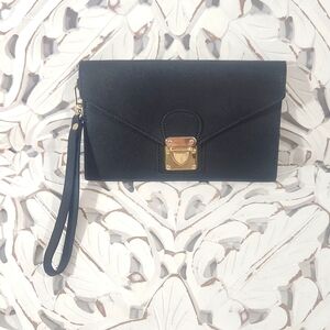 Black and gold wristlet with unique closure